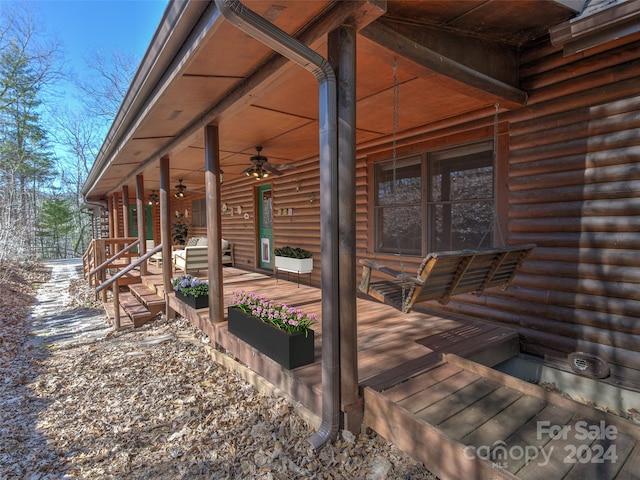 deck featuring a grill and ceiling fan