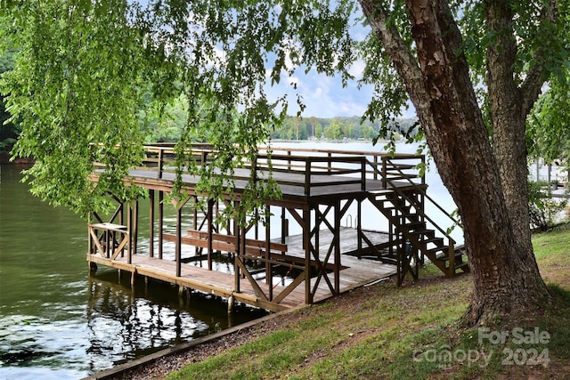 dock area featuring a water view