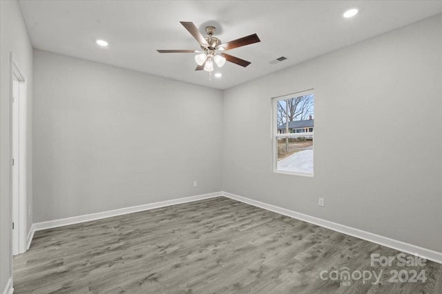 spare room featuring ceiling fan and light wood-type flooring