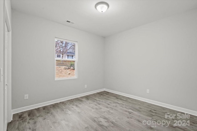 spare room with light wood-type flooring