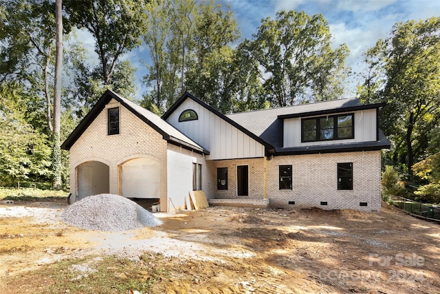 view of front of home with a garage