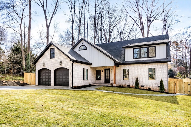 view of front of house featuring a garage and a front yard