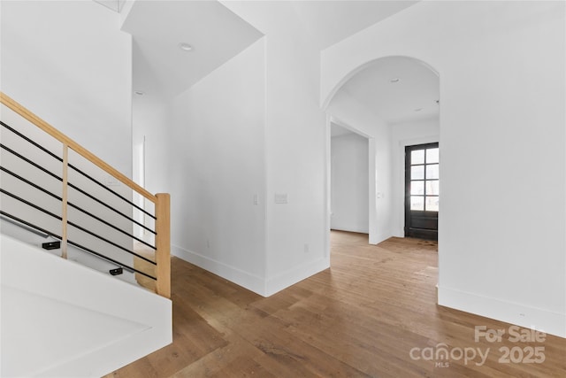 stairs with hardwood / wood-style flooring