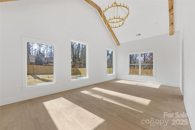 interior space with an inviting chandelier and lofted ceiling