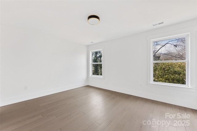 spare room featuring hardwood / wood-style flooring