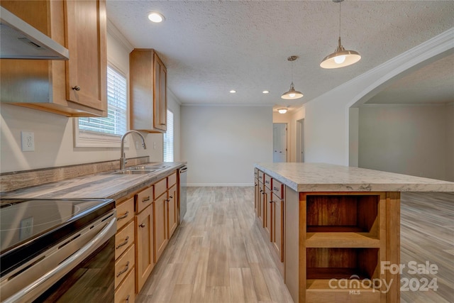 kitchen with a center island, decorative light fixtures, a textured ceiling, wall chimney exhaust hood, and sink