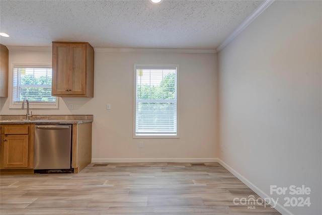 kitchen with sink, a textured ceiling, dishwasher, and a wealth of natural light