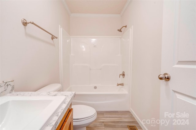 full bathroom featuring toilet, vanity, a textured ceiling, shower / tub combination, and ornamental molding