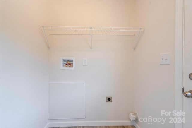 laundry area featuring washer hookup, wood-type flooring, and electric dryer hookup