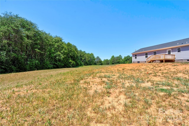 view of yard featuring a wooden deck