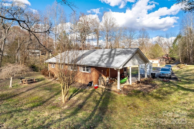 rear view of house with a lawn