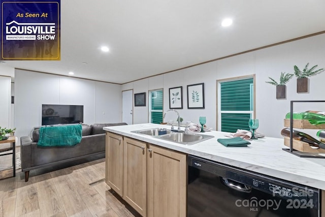 kitchen with light brown cabinetry, light hardwood / wood-style floors, light stone counters, sink, and black dishwasher