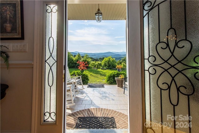 interior space with a wealth of natural light and a mountain view