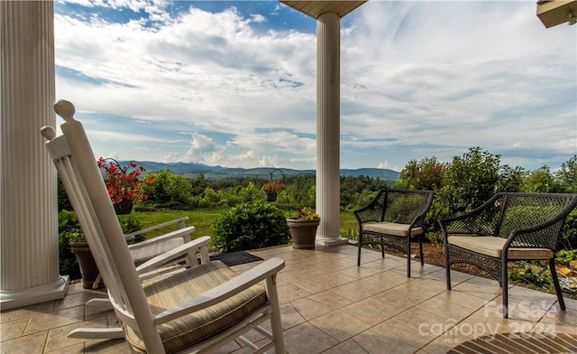 view of patio / terrace featuring a mountain view