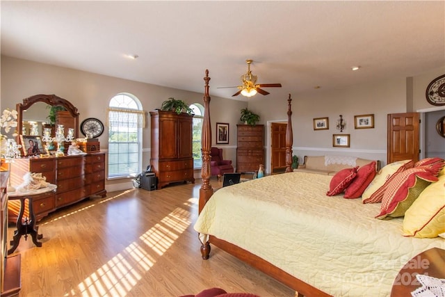 bedroom featuring ceiling fan and light hardwood / wood-style flooring