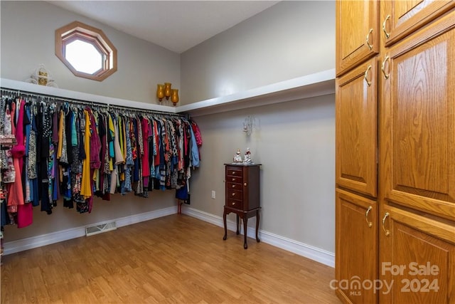 spacious closet featuring light hardwood / wood-style floors