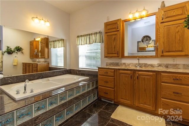 bathroom featuring vanity, tile floors, and a relaxing tiled bath