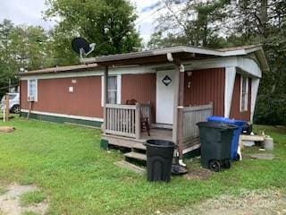 view of shed / structure with a lawn