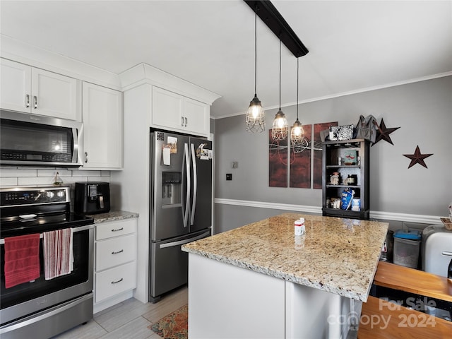 kitchen with a kitchen breakfast bar, appliances with stainless steel finishes, white cabinets, tasteful backsplash, and pendant lighting