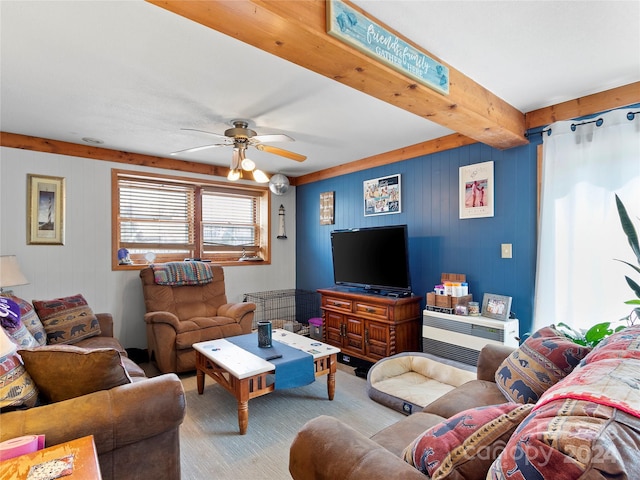 living room featuring ceiling fan and beam ceiling