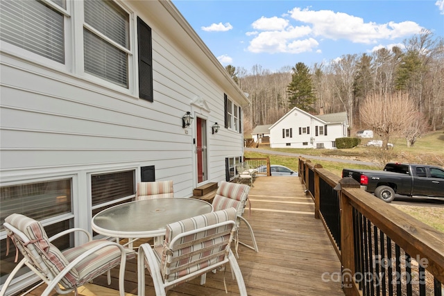 deck featuring outdoor dining area