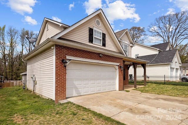 view of front of property featuring a front yard and a garage