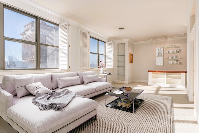 living room with ornamental molding and light colored carpet