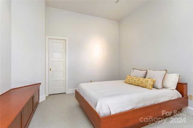 bedroom with light colored carpet