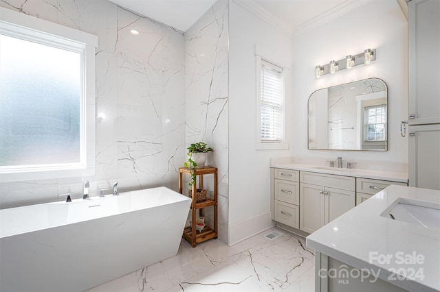 bathroom featuring a tub, crown molding, and vanity