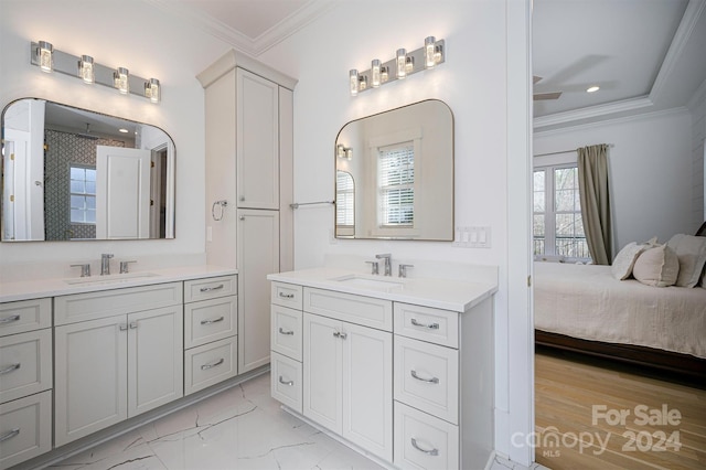 bathroom featuring vanity, ceiling fan, ornamental molding, and curtained shower