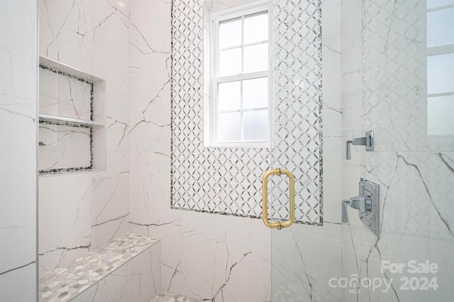 bathroom with an enclosed shower