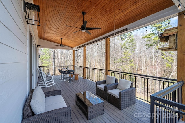 wooden deck with outdoor lounge area