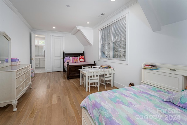 bedroom featuring light wood-type flooring and crown molding