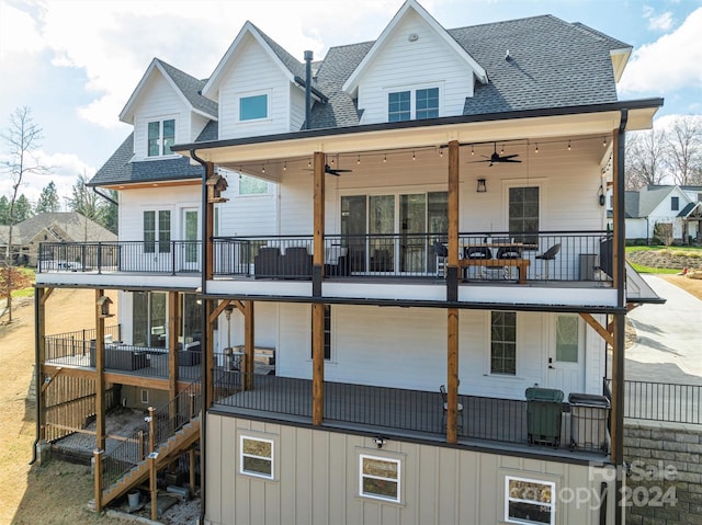 back of house featuring a balcony