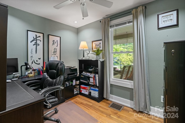 office area with ceiling fan and light hardwood / wood-style flooring