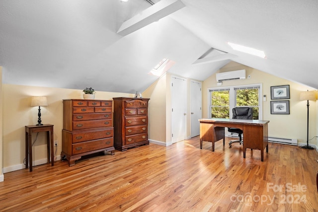 office area featuring vaulted ceiling with skylight, light hardwood / wood-style flooring, an AC wall unit, and a baseboard radiator