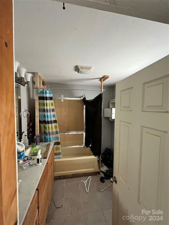 bathroom featuring tile floors, shower / bath combo, and vanity