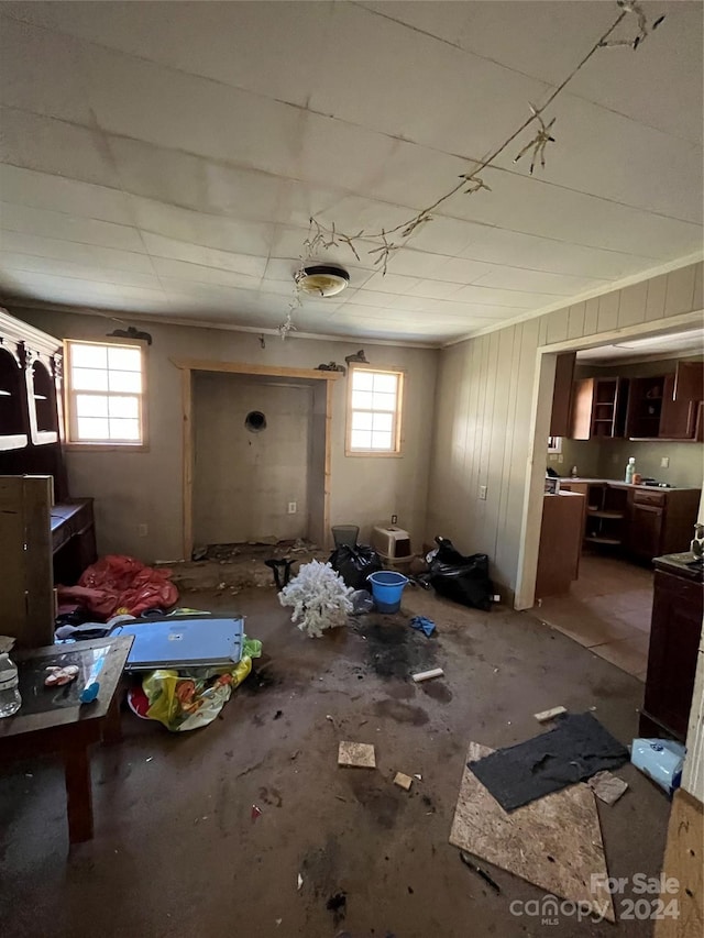 miscellaneous room featuring concrete flooring and a wealth of natural light