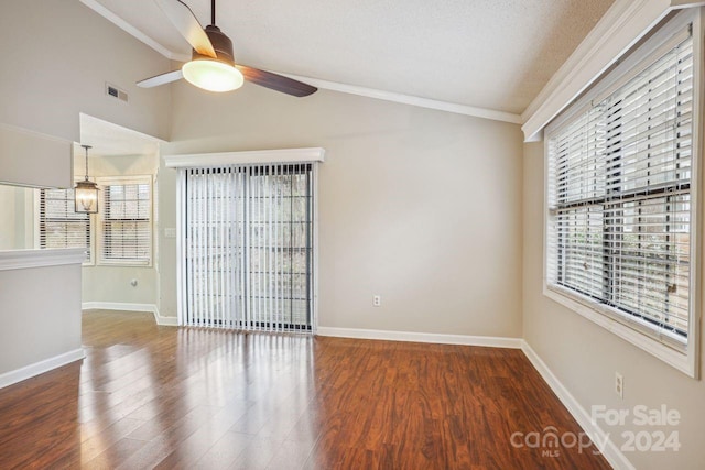 unfurnished room featuring ceiling fan, crown molding, and dark hardwood / wood-style floors