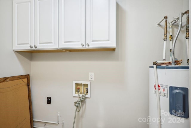 washroom featuring water heater, cabinets, hookup for an electric dryer, and hookup for a washing machine