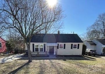 single story home with a front lawn