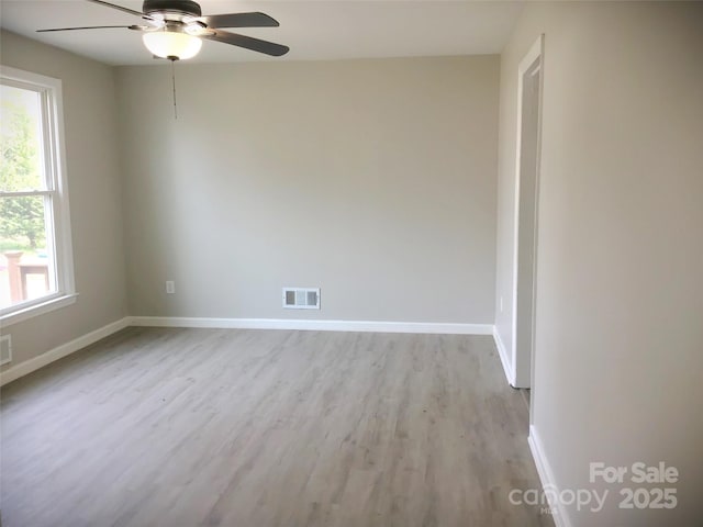 spare room with ceiling fan and light hardwood / wood-style floors