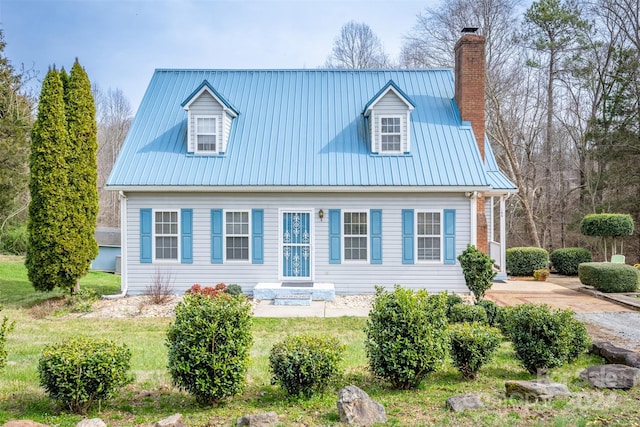 rear view of property featuring a lawn