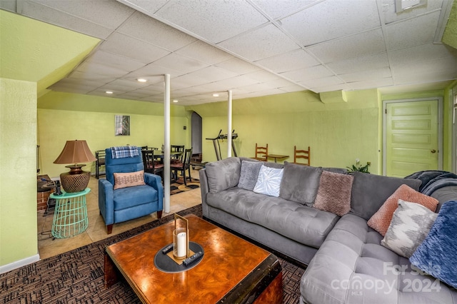 living room featuring a paneled ceiling