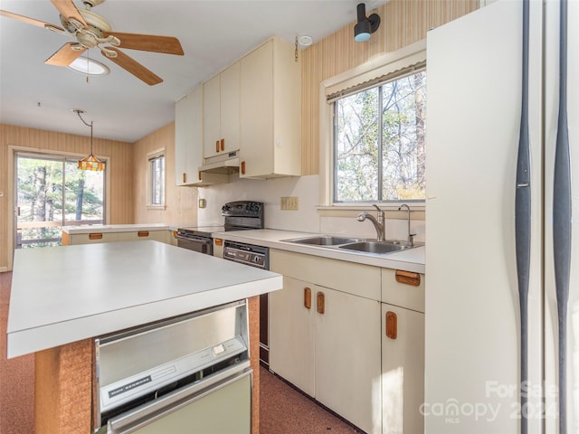 kitchen featuring white fridge, ceiling fan, electric range, sink, and dishwasher