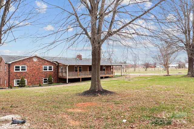 view of yard with a wooden deck