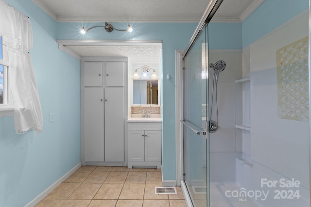 bathroom featuring vanity, walk in shower, backsplash, tile floors, and crown molding