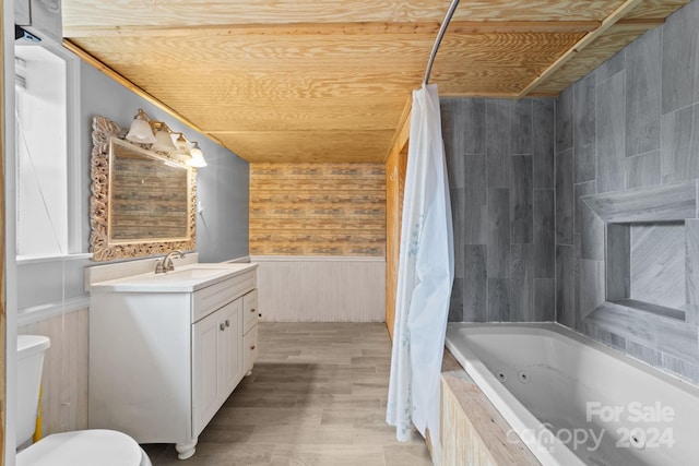 full bathroom with shower / bathtub combination with curtain, toilet, vanity, and hardwood / wood-style flooring