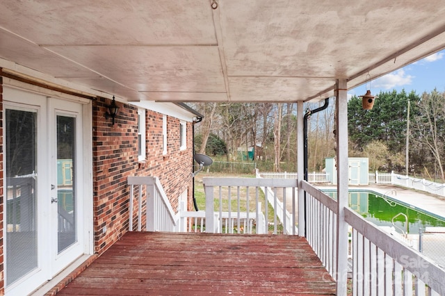 deck with a fenced in pool