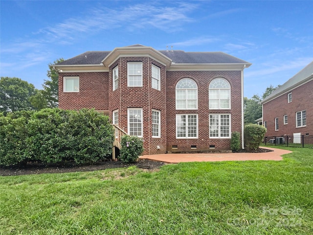 exterior space with a yard and a patio area